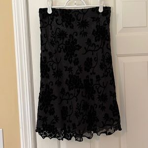 Black skirt with velvet flower detail